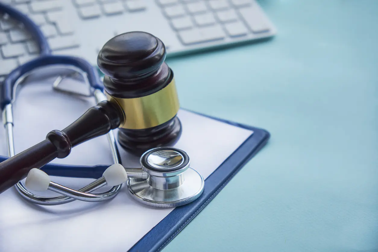 Gavel and stethoscope. medical jurisprudence. legal definition of medical malpractice. attorney. common errors doctors, nurses and hospitals make